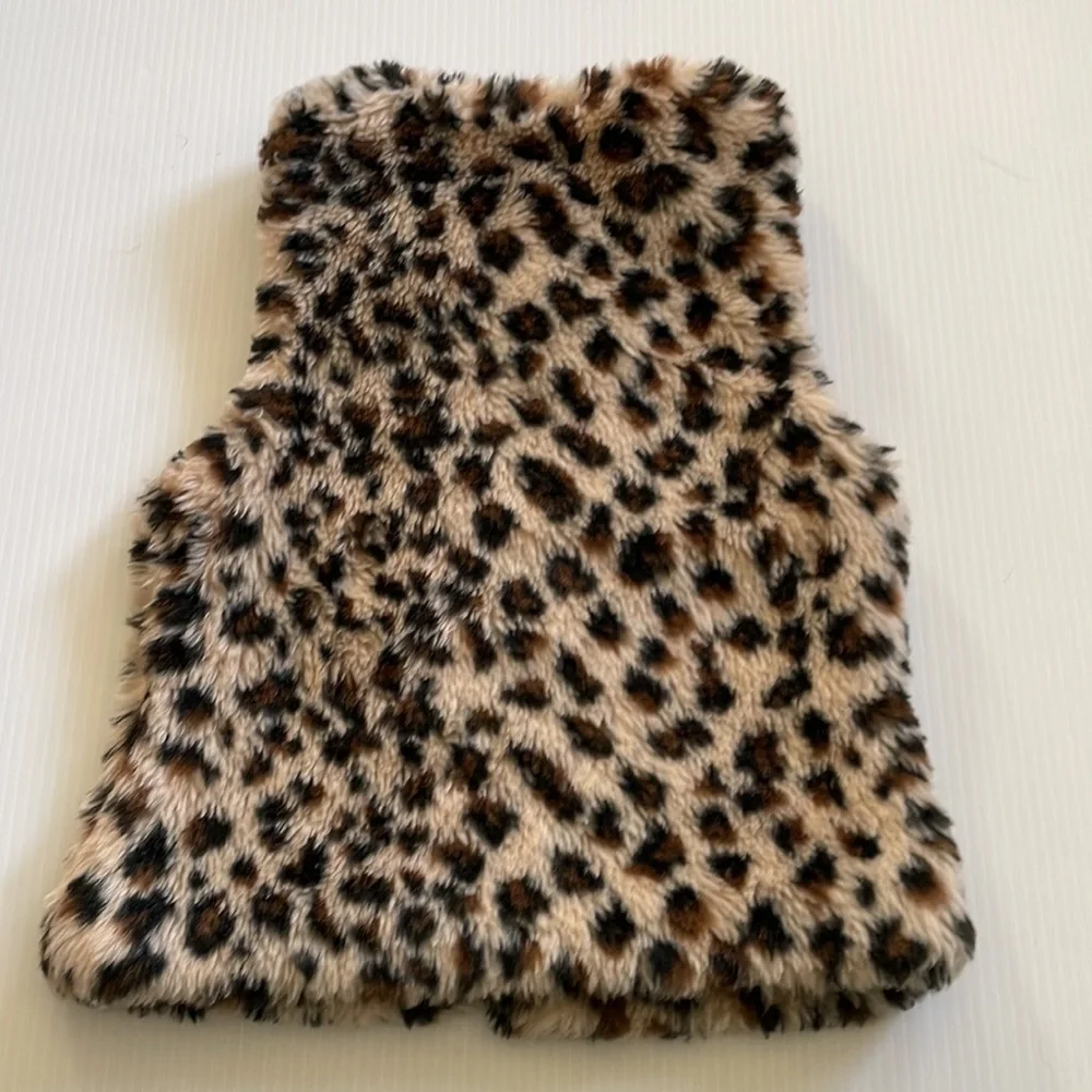 Me Jane black, brown & tan faux fur vest.  Girl’s size 7